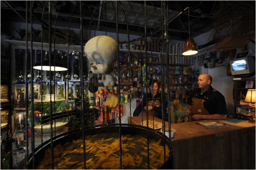 Banksys NYC Installation The Village Pet Store and Charcoal Grill 